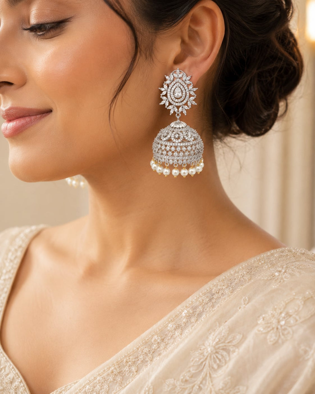 FeelOri Oval Halo Silver Rhodium CZ Jhumka Earrings with Pearl Look Drops - model styling view