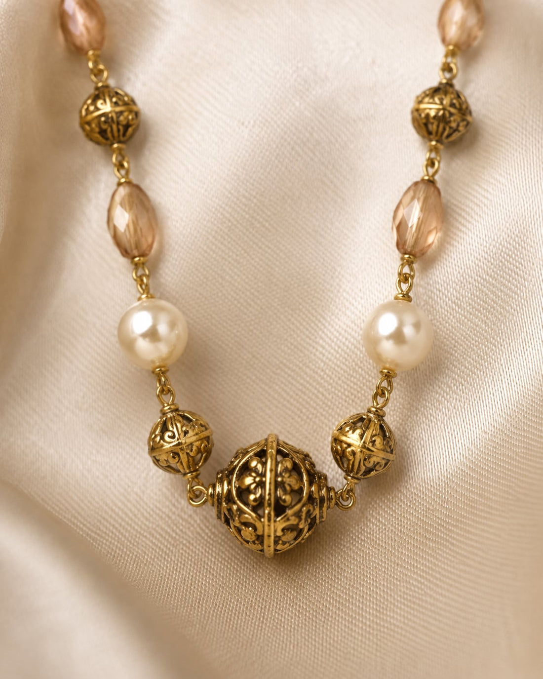 FeelOri Peach Faceted Bead and Pearl-Look Necklace close-up of bead rhythm, filigree centre, and clasp