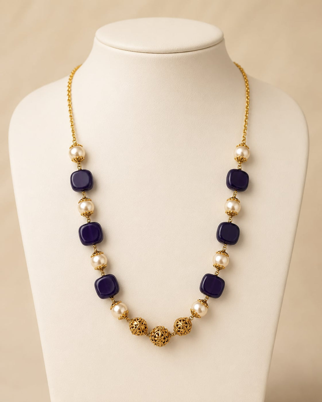 FeelOri gold-polished necklace on jewellery display
