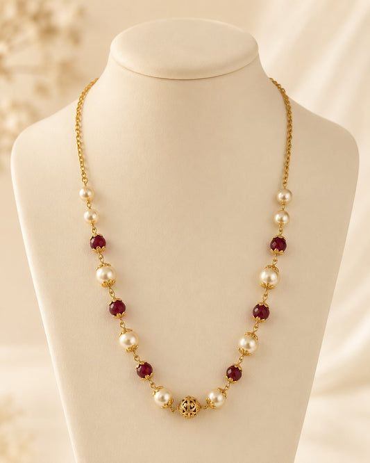 FeelOri wine red bead and pearl-look 18-inch necklace on an ivory display