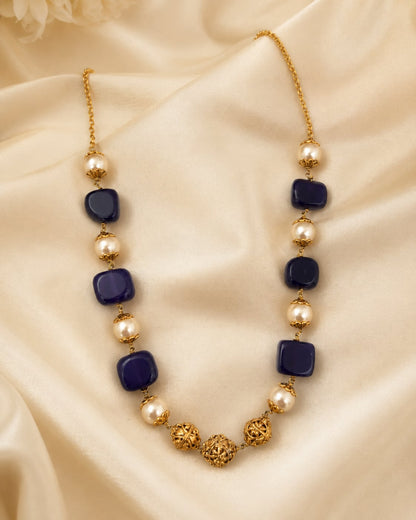 FeelOri gold-polished necklace styled with saree fabric for Indian occasion wear