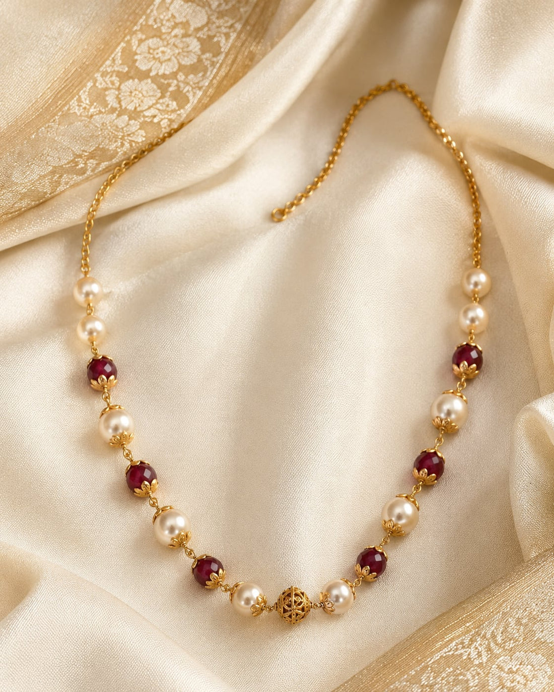FeelOri gold-polished necklace styled with saree fabric for Indian occasion wear