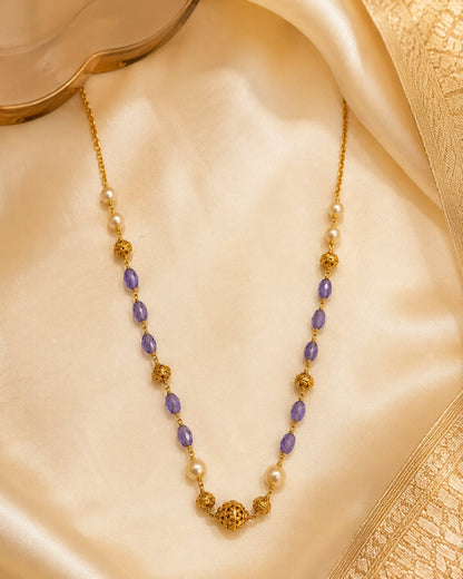 FeelOri gold-polished necklace styled with saree fabric for Indian occasion wear
