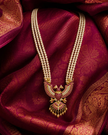 FeelOri pearl strand peacock jadau kundan long haram necklace on jewellery display