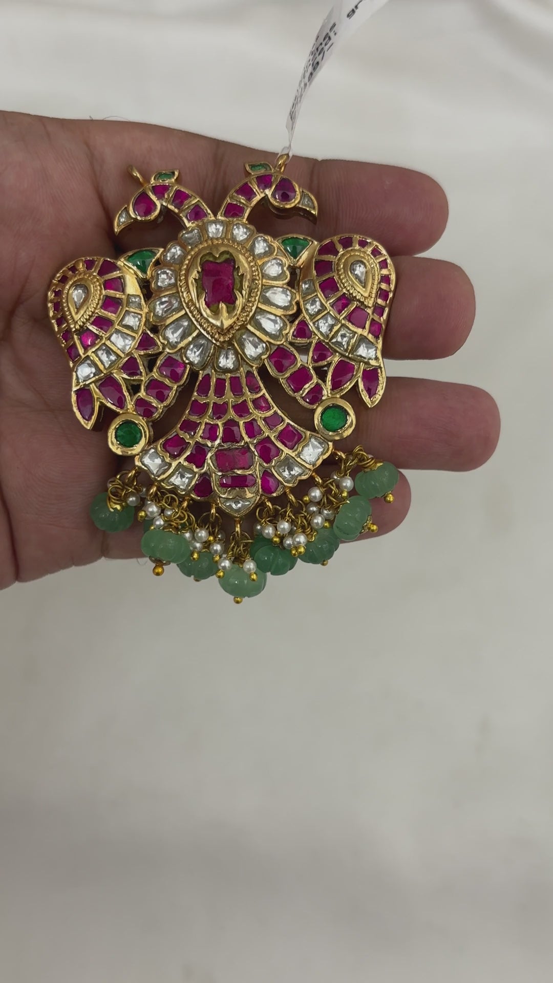 FeelOri FO-RKJ-0048 reversible Gandaberunda pendant showing its ruby-tone and white kundan sides.
