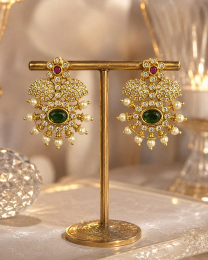 FeelOri ruby and emerald earrings on jewellery display