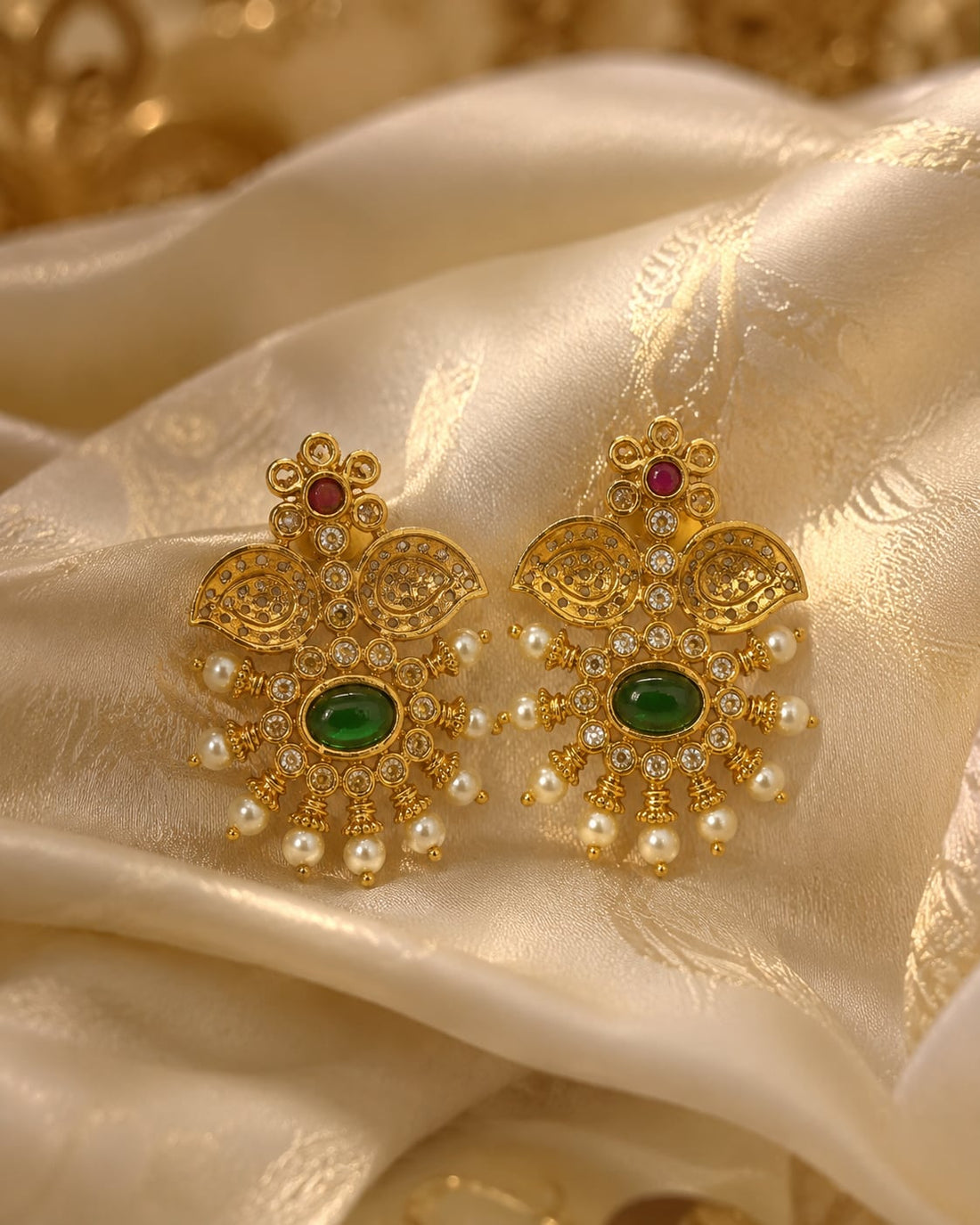 FeelOri ruby and emerald earrings styled with saree fabric for Indian occasion wear