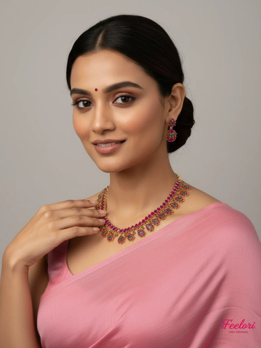 FeelOri Gold Plated Ruby Emerald Floral Necklace Set - Model wearing elegant set with pink traditional attire.