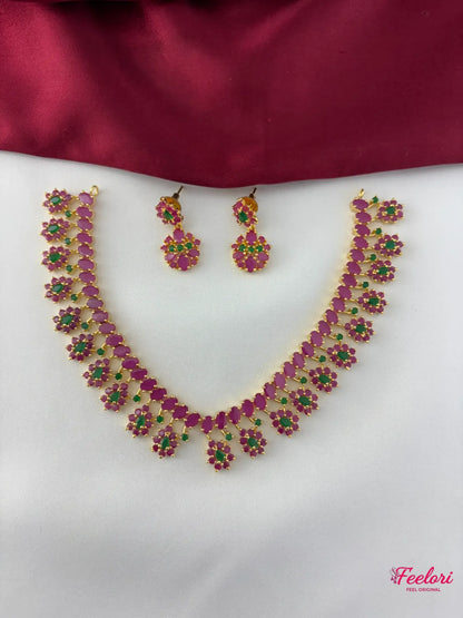 FeelOri Gold Plated Ruby Emerald Floral Necklace Set - Front view showcasing the complete set with interconnected floral motifs.