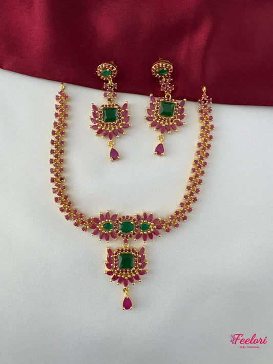 FeelOri Gold Plated Ruby Emerald Floral Necklace Set - Front view showcasing vibrant stones and coordinated design.