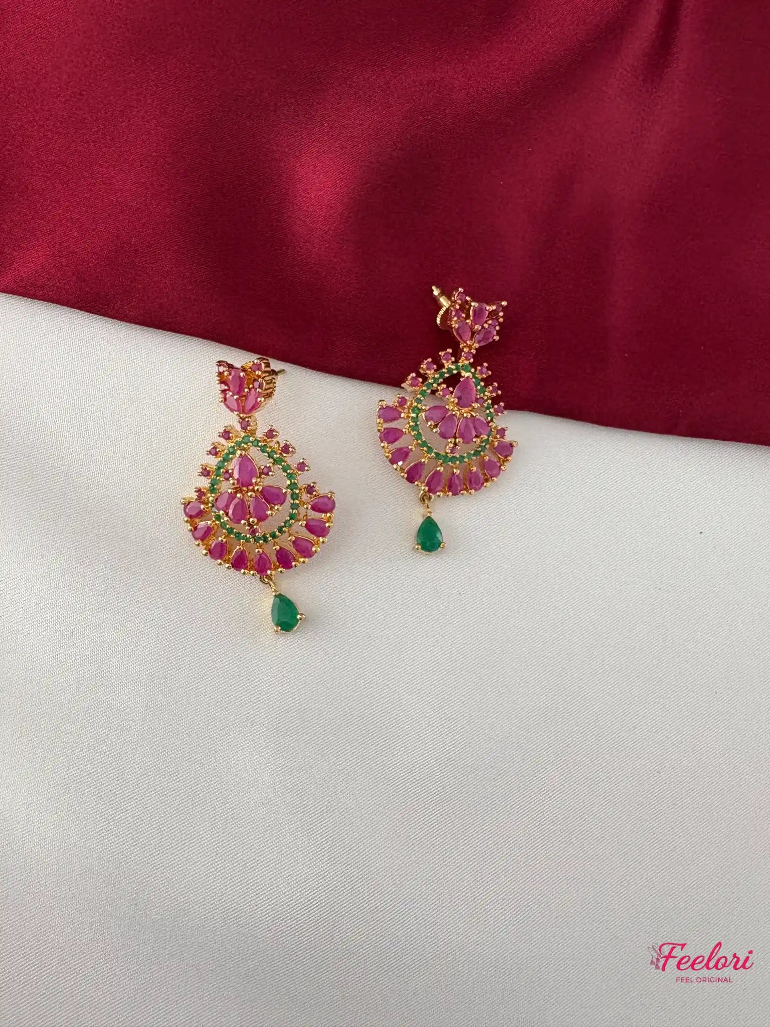 FeelOri Gold Plated Ruby Emerald Earrings - Close-up view of the fan-like cluster earrings with intricate ruby and emerald stone detailing and a green drop.