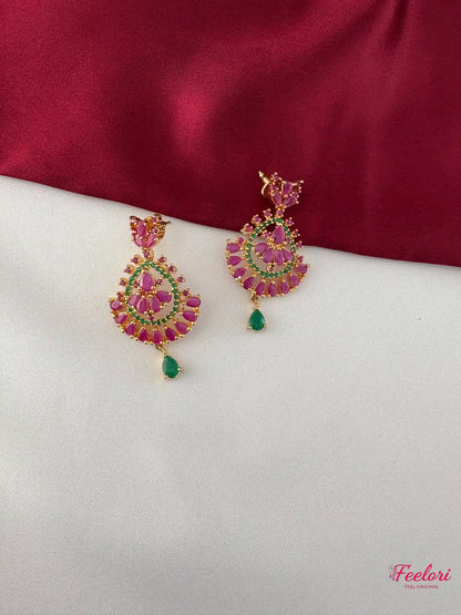 FeelOri Gold Plated Ruby Emerald Earrings - Close-up view of the fan-like cluster earrings with intricate ruby and emerald stone detailing and a green drop.