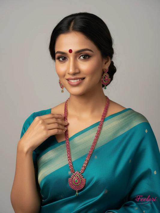 FeelOri Gold Plated Ruby Emerald Necklace Set - Model in traditional saree showcasing grand design.