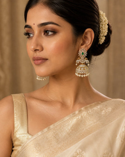 FeelOri ruby and emerald jhumka earrings styled with saree fabric for Indian occasion wear