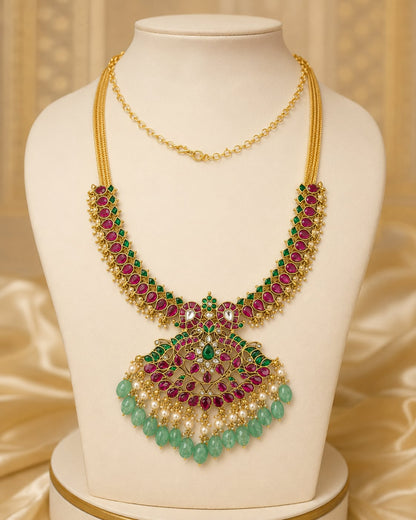FeelOri ruby green peacock motif jadau kundan necklace with large pendant on display