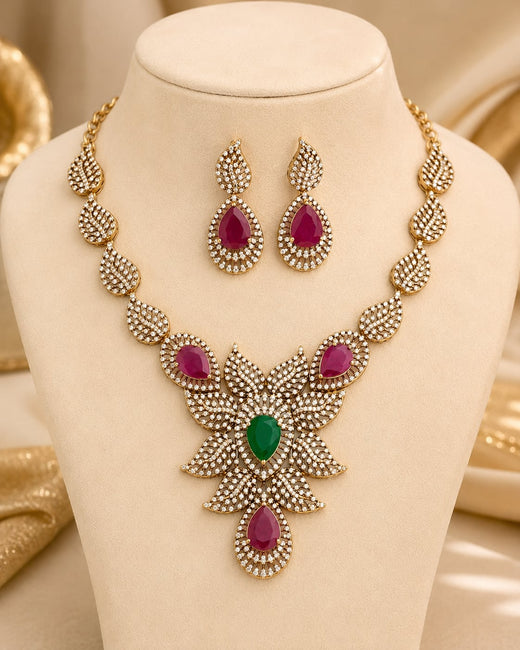 FeelOri ruby and emerald necklace set with matching earrings on jewellery display