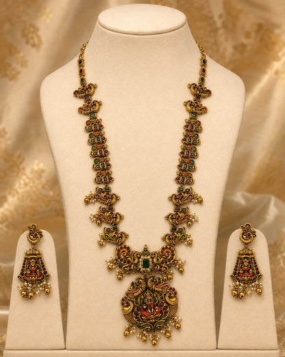 FeelOri ruby and emerald necklace set with matching earrings on jewellery display