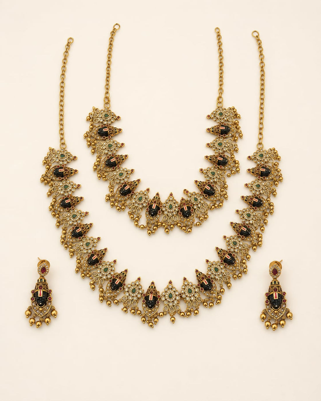 FeelOri ruby and emerald necklace set with matching earrings on jewellery display