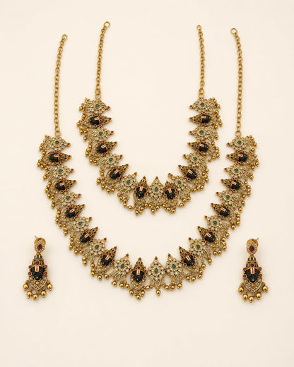 FeelOri ruby and emerald necklace set with matching earrings on jewellery display