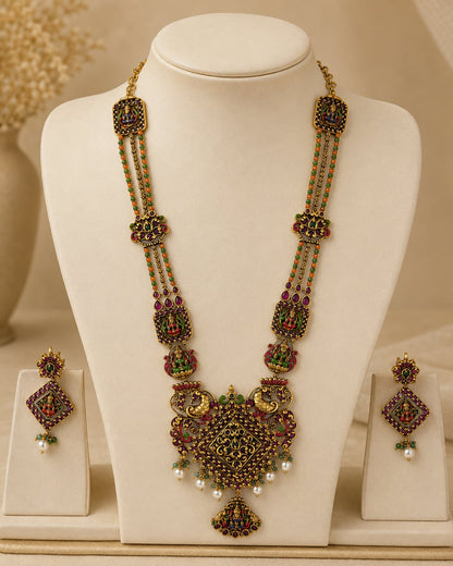 FeelOri ruby and emerald necklace set with matching earrings on jewellery display