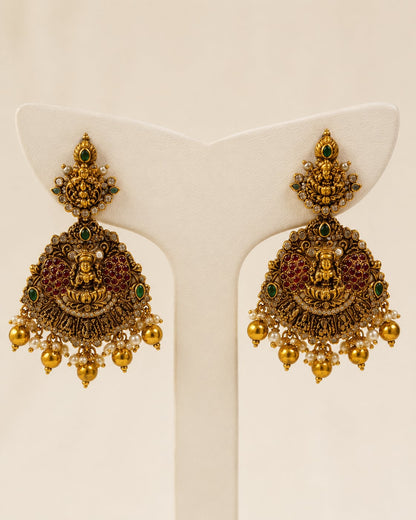 FeelOri ruby and emerald necklace set with matching earrings matching earrings only on a clean jewellery display