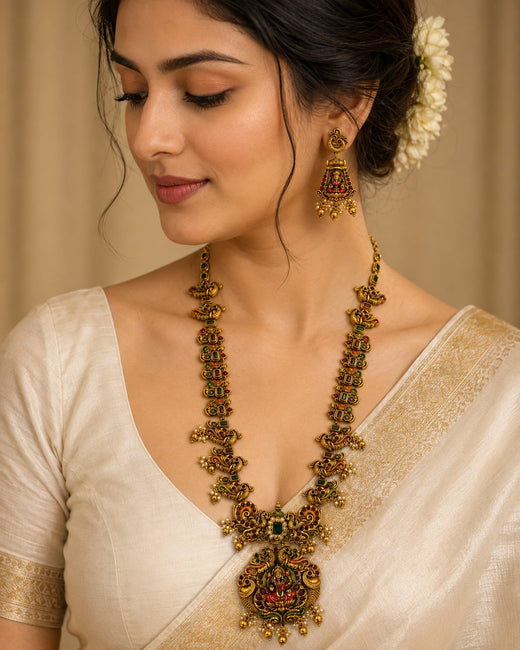 FeelOri ruby and emerald necklace set with matching earrings styled with Indian occasion wear