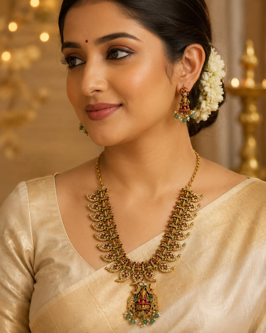 FeelOri ruby and emerald necklace set with matching earrings styled with Indian occasion wear