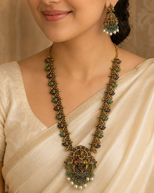 FeelOri ruby and emerald necklace set with matching earrings styled with Indian occasion wear