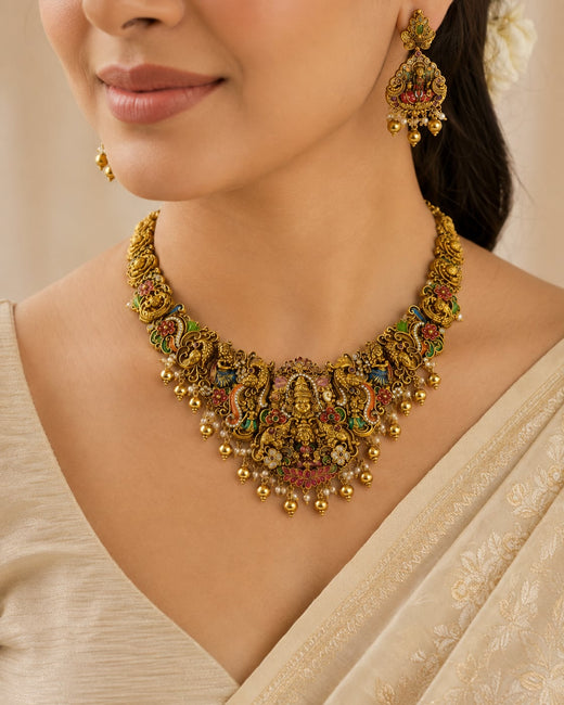 FeelOri ruby and emerald necklace set with matching earrings styled with Indian occasion wear