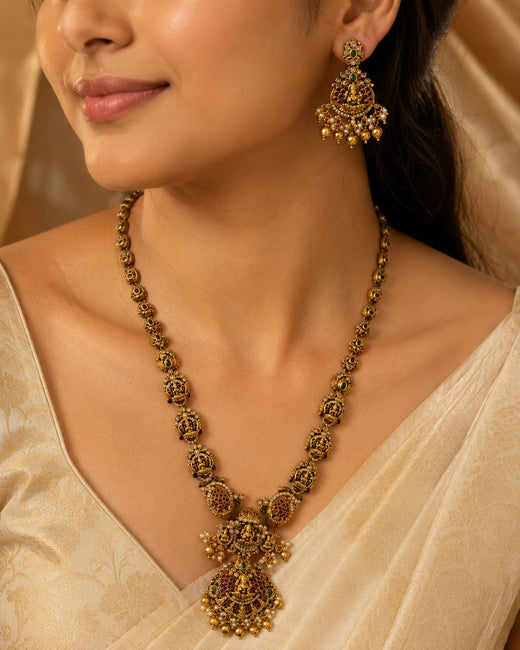FeelOri ruby and emerald necklace set with matching earrings styled with Indian occasion wear