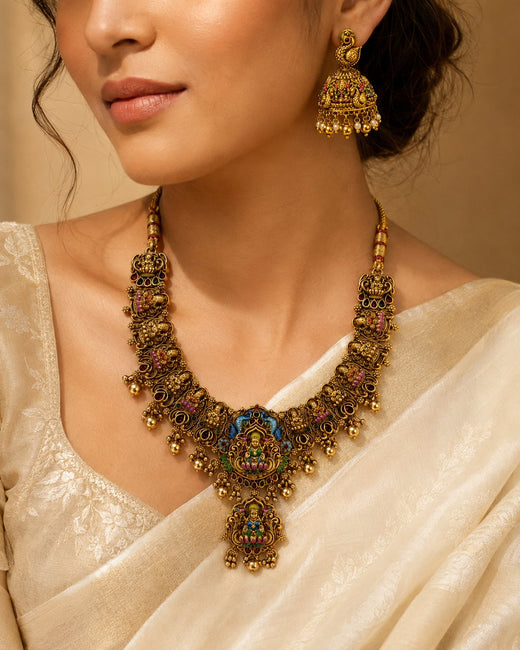 FeelOri ruby and emerald necklace set with matching earrings styled with Indian occasion wear
