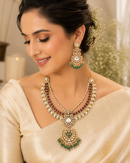 FeelOri ruby-tone and emerald-tone necklace set with matching earrings styled with saree fabric for Indian occasion wear