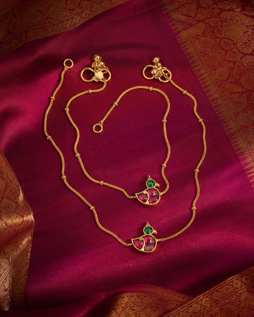 FeelOri ruby floral jadau kundan payal anklets listed as a pair of anklets styled on foot with Indian occasion wear