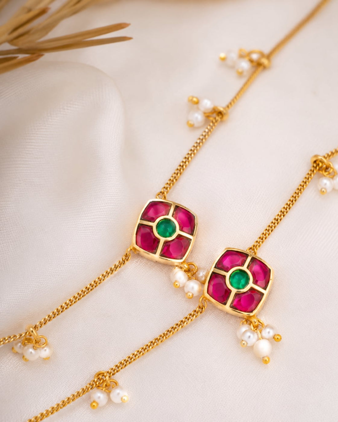 FeelOri ruby green model jadau kundan payal anklets listed as a pair of anklets styled with saree fabric