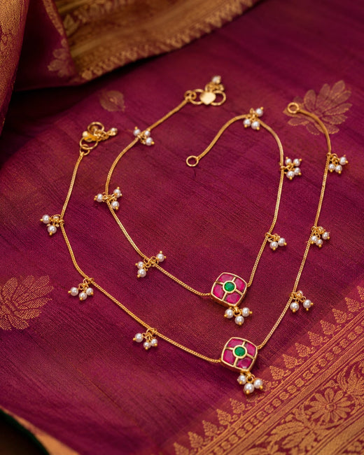 FeelOri ruby green model jadau kundan payal anklets listed as a pair of anklets styled on foot with Indian occasion wear