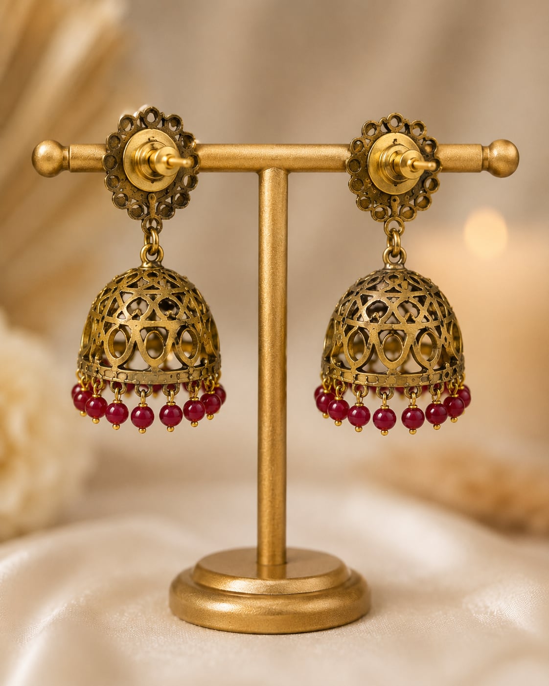 FeelOri ruby jhumka earrings rear view showing openwork reverse, straight posts, and push-back closures