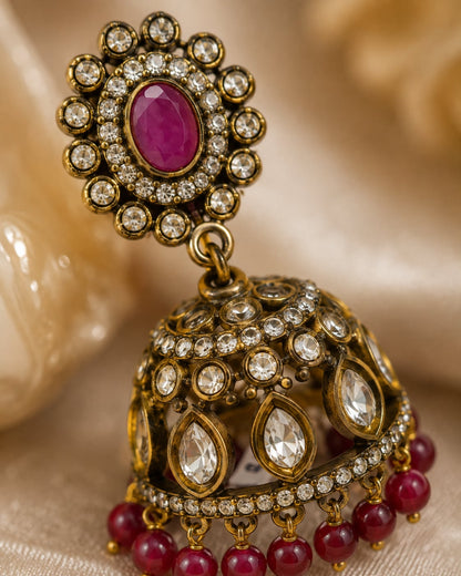 FeelOri ruby jhumka earrings stone setting, ear-chain or earring construction, and gold-polished finish detail