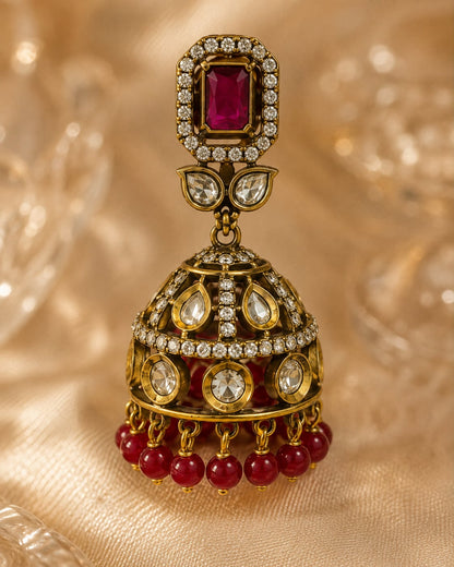 FeelOri ruby jhumka earrings stone setting, ear-chain or earring construction, and gold-polished finish detail