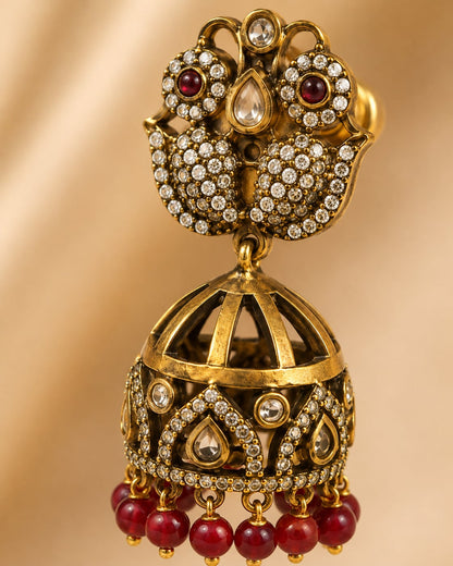 FeelOri ruby jhumka earrings stone setting, ear-chain or earring construction, and gold-polished finish detail