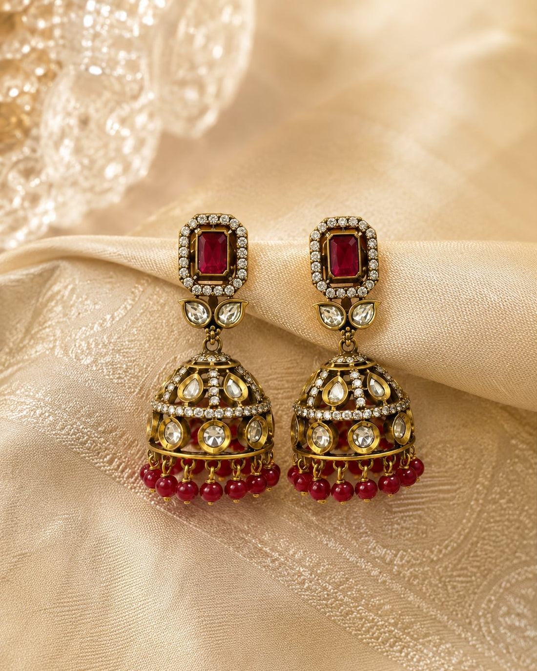 FeelOri ruby jhumka earrings styled with saree fabric for Indian occasion wear