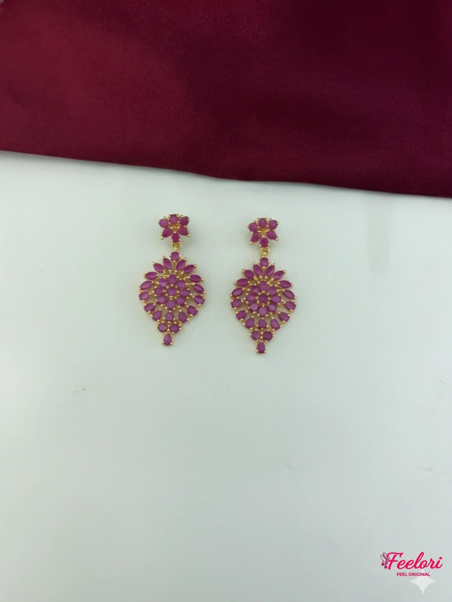 FeelOri Gold Plated Ruby Leaf Cluster Earrings - Detailed view of the matching earrings, highlighting the vibrant ruby-hued stones and craftsmanship.
