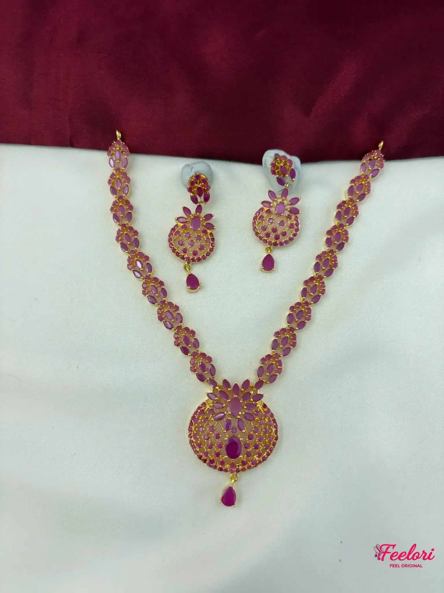 FeelOri Gold Plated Ruby Petal Necklace Set - Full view showcasing the intricate oval-cut chain and matching floral pendant with teardrop accent.