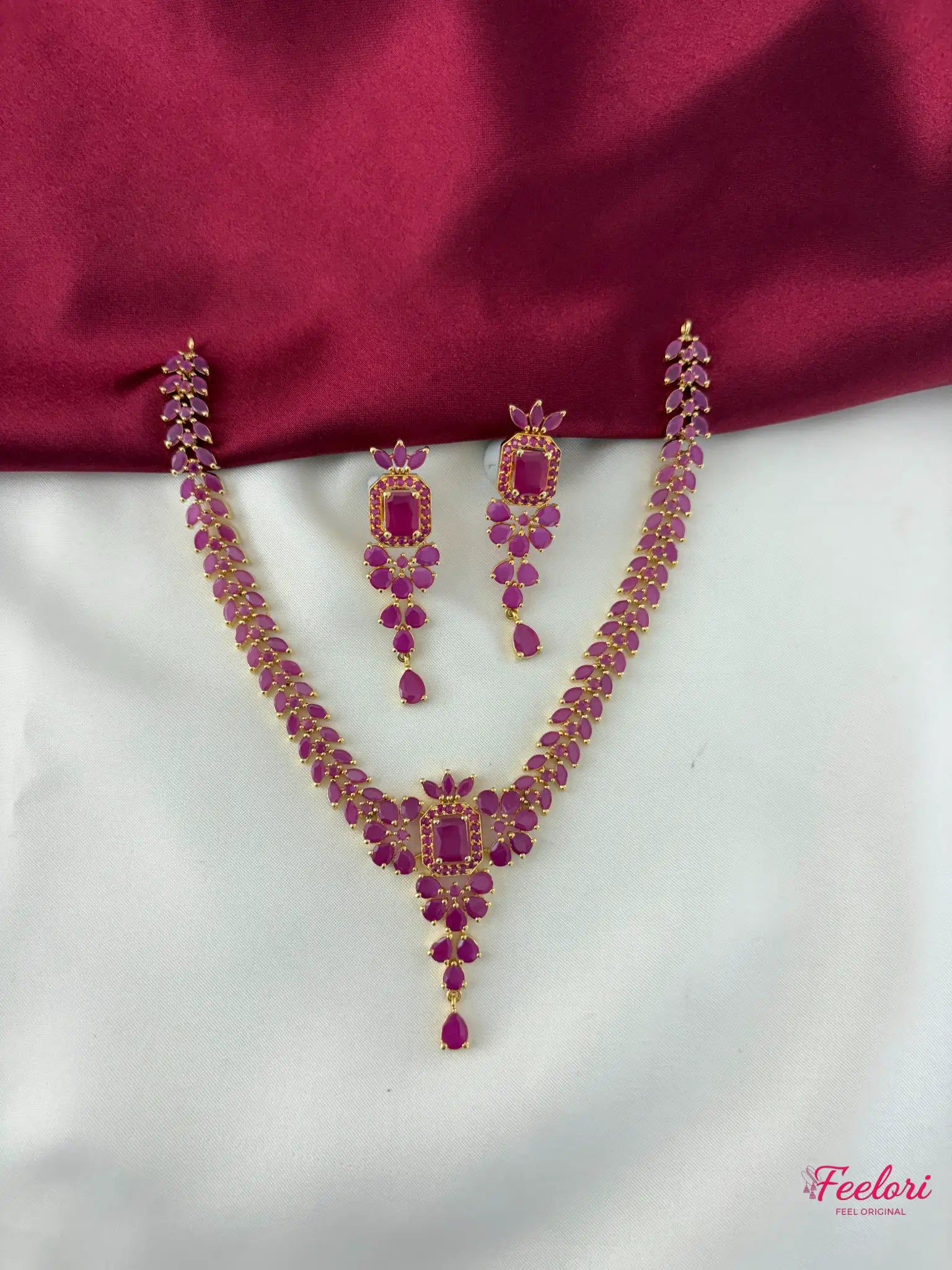 FeelOri Gold Plated Ruby Petal Necklace Set - Front view showcasing the complete cascading design with matching earrings.