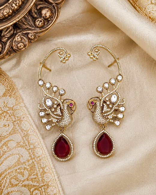 FeelOri ruby-tone matti ear chains styled with saree fabric for Indian occasion wear