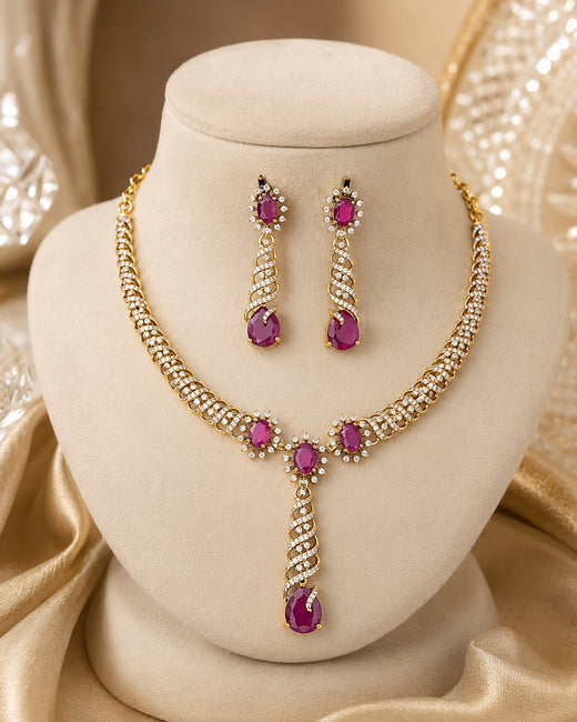 FeelOri ruby-tone necklace set with matching earrings on jewellery display