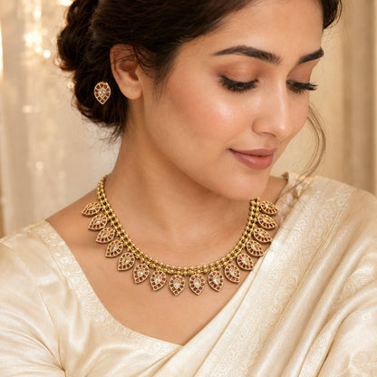 FeelOri ruby-tone necklace set with matching earrings styled with saree fabric for Indian occasion wear