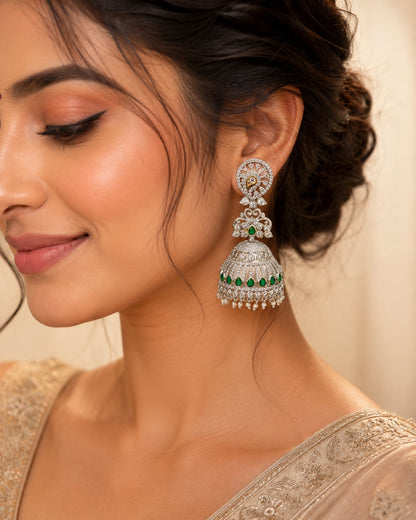 Model wearing FeelOri silver-tone rhodium-finish emerald-fringe CZ jhumka earrings for Indian occasion styling